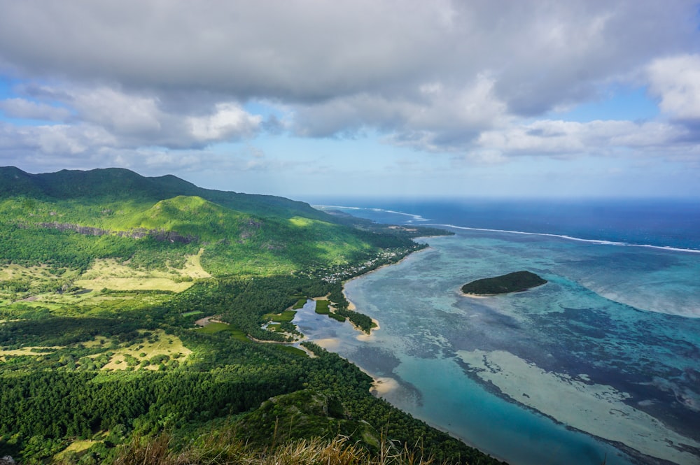 an aerial view of the ocean and land