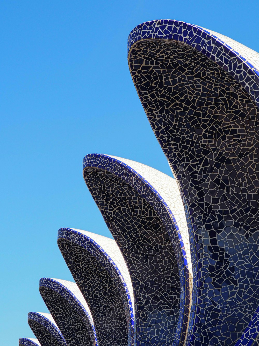 a close up of a building with a blue sky in the background