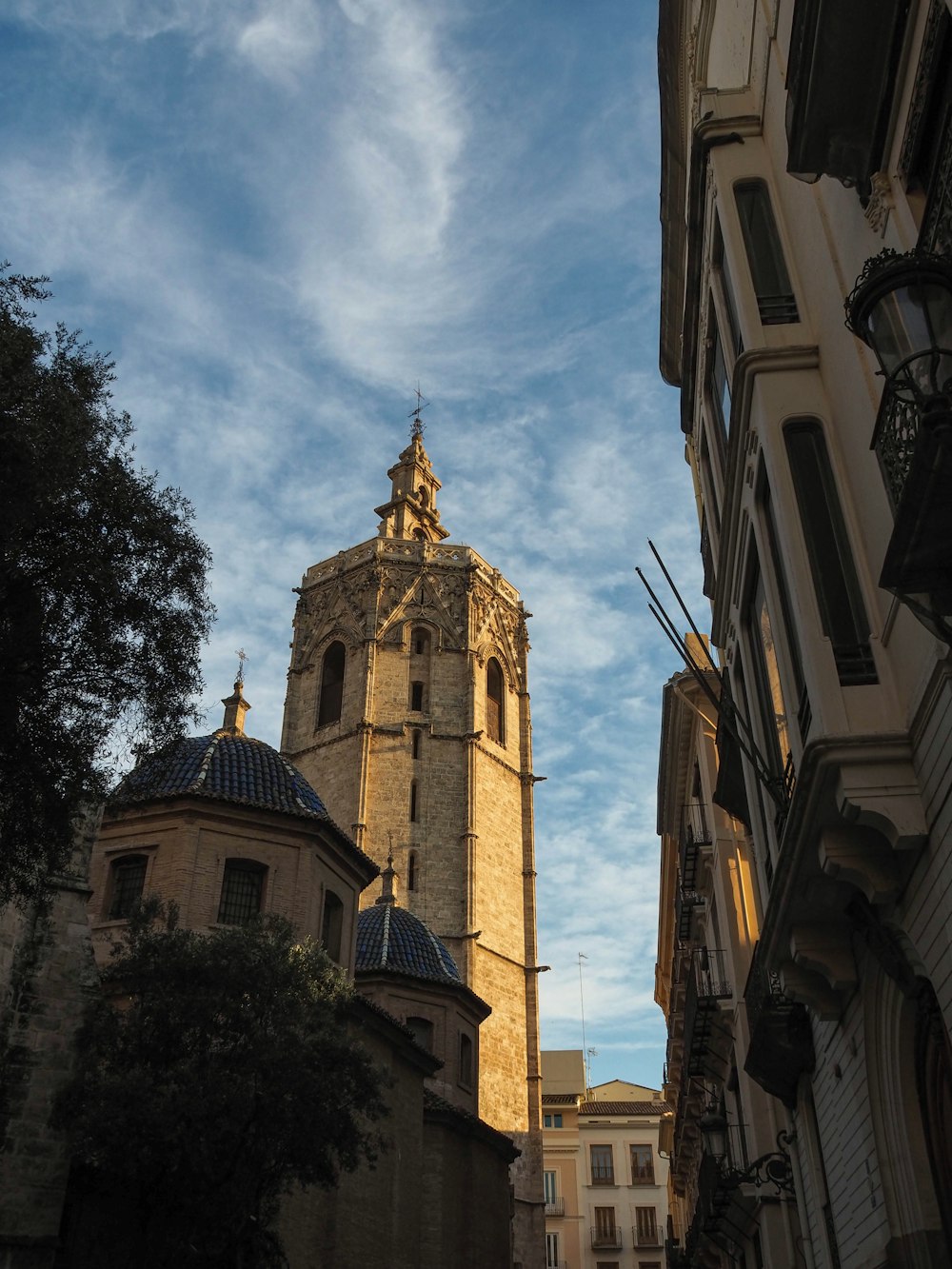 a tall clock tower towering over a city