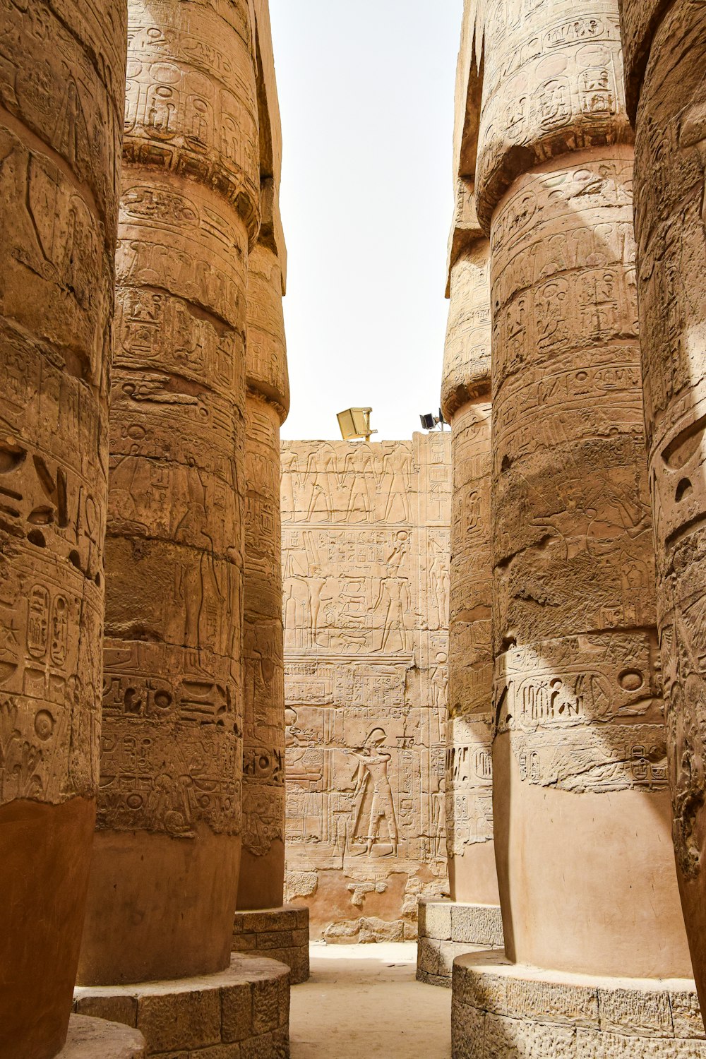 a group of large stone pillars with carvings on them