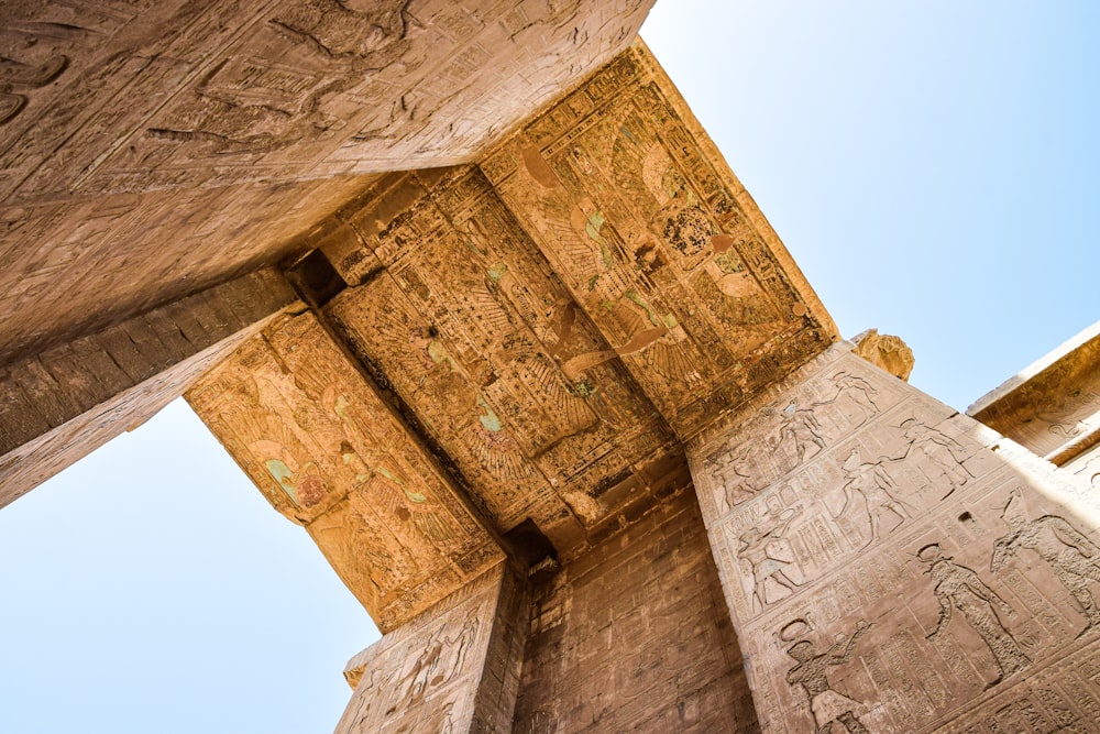 a tall building with carvings on the side of it