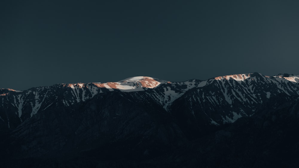 a view of the top of a mountain at night