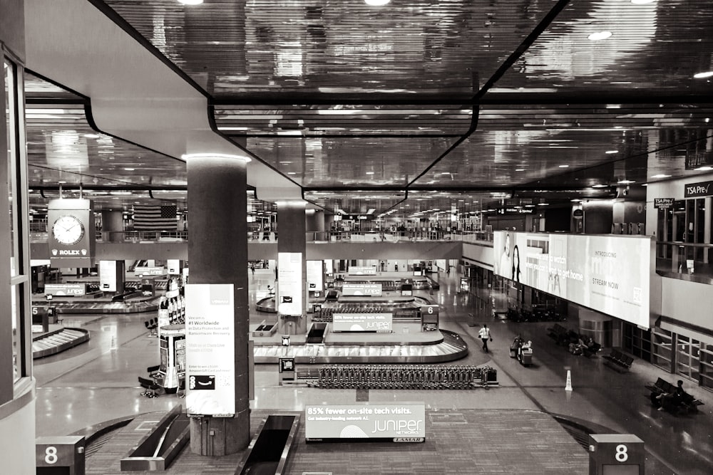 a black and white photo of a train station