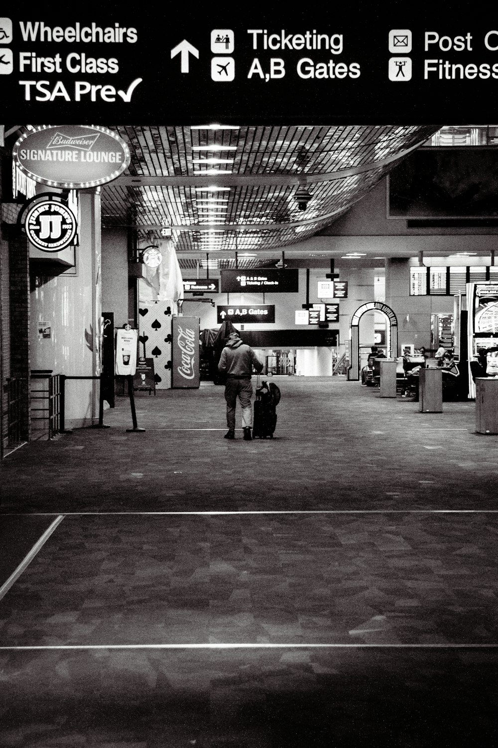 a black and white photo of a tennis court