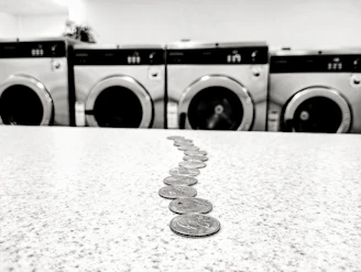 a row of coin sitting on top of a counter