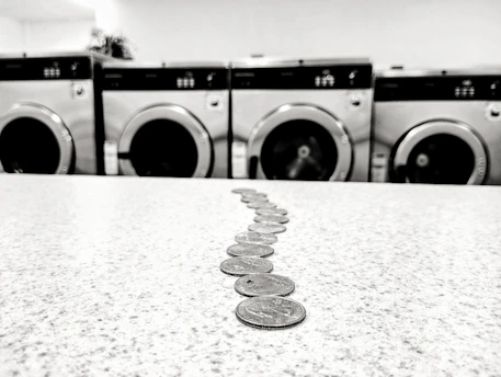 a row of coin sitting on top of a counter