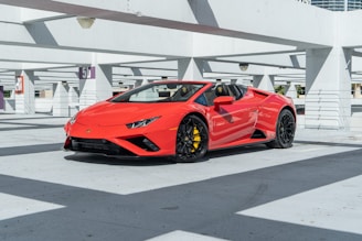 a red sports car parked in a parking lot