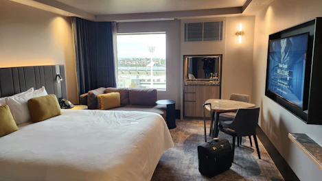 Simple yet welcoming standard room featuring a cozy seating area.