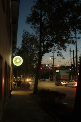 The exterior of Radiant Smiles Dentistry at 3314 Bona St, Oakland, glowing at dusk.