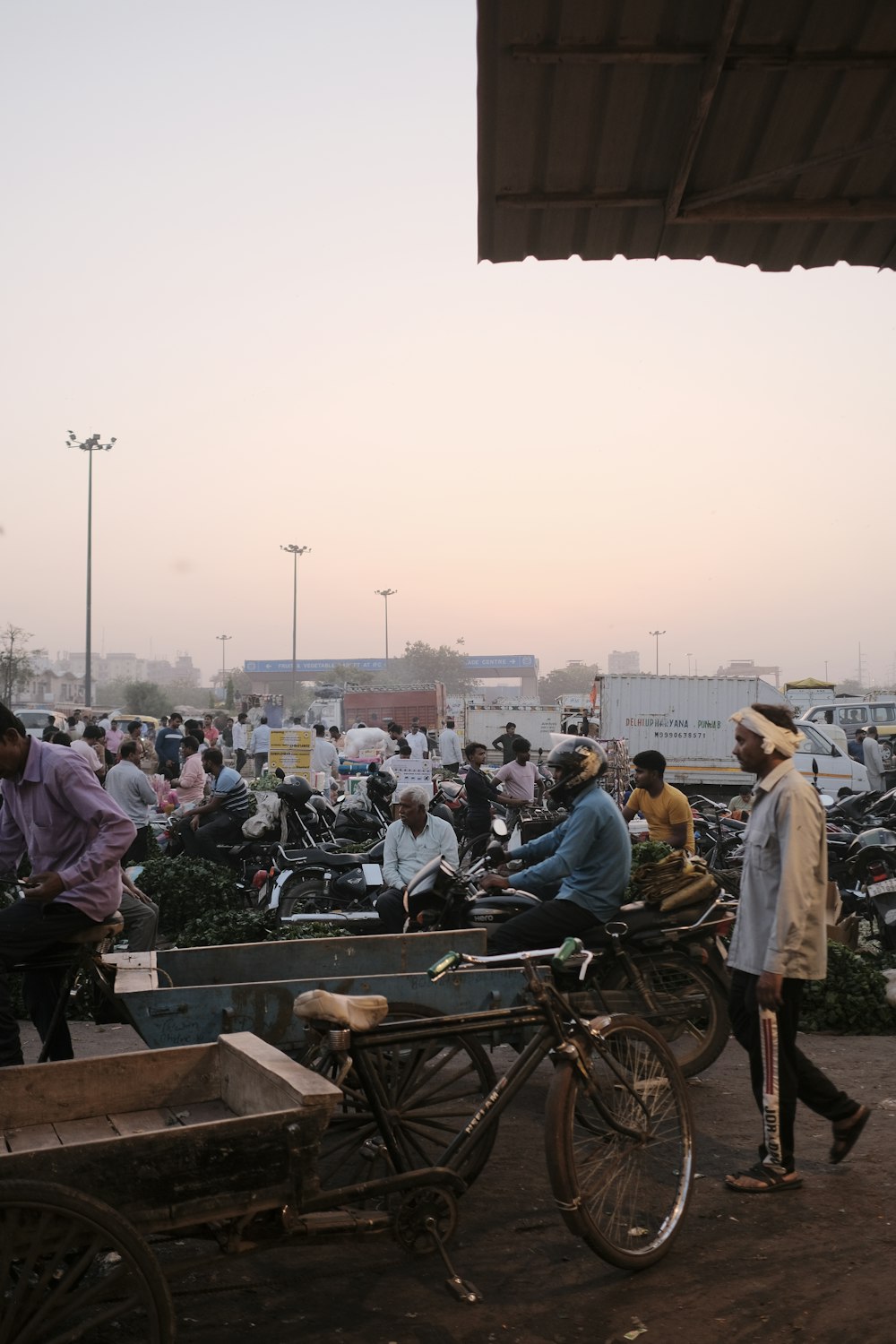 a group of people standing around a motorcycle