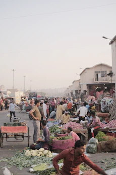a group of people walking around a market