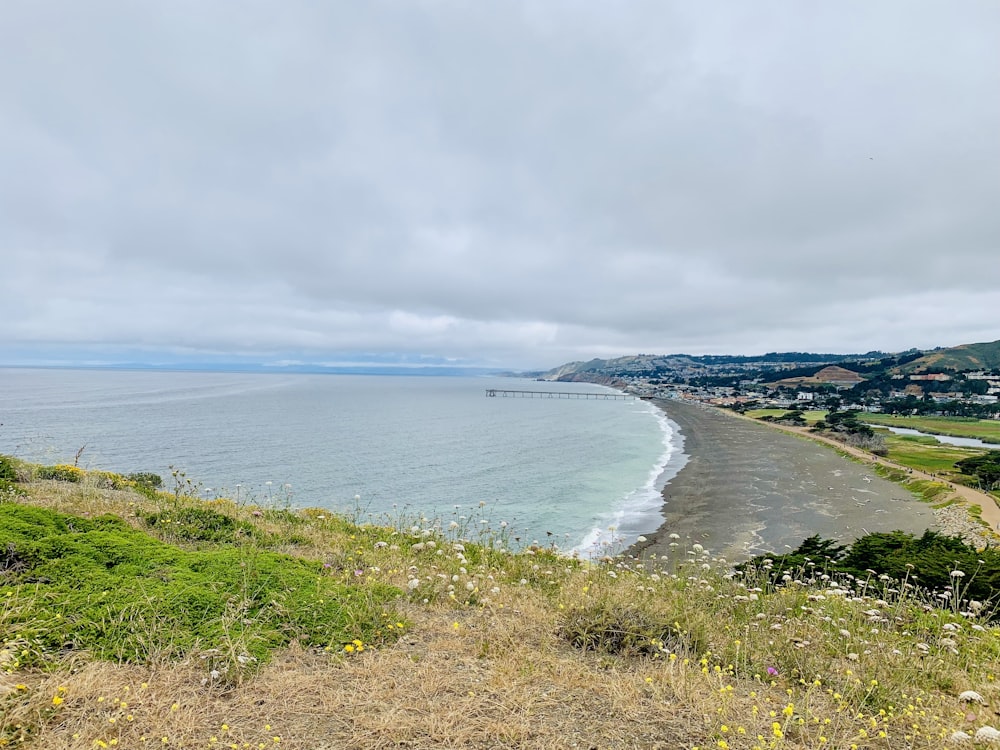 a view of the ocean from the top of a hill