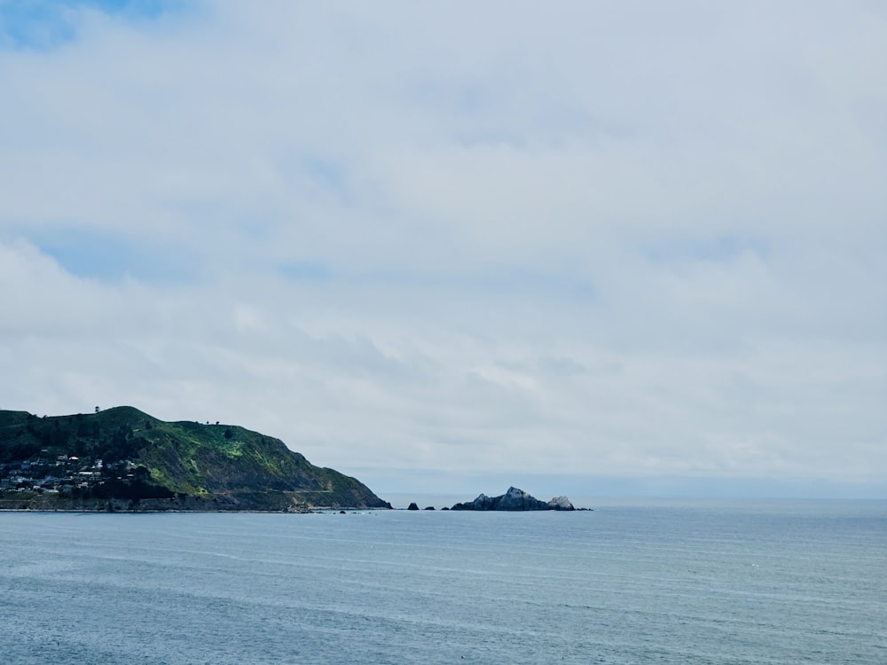 a body of water with a small island in the distance