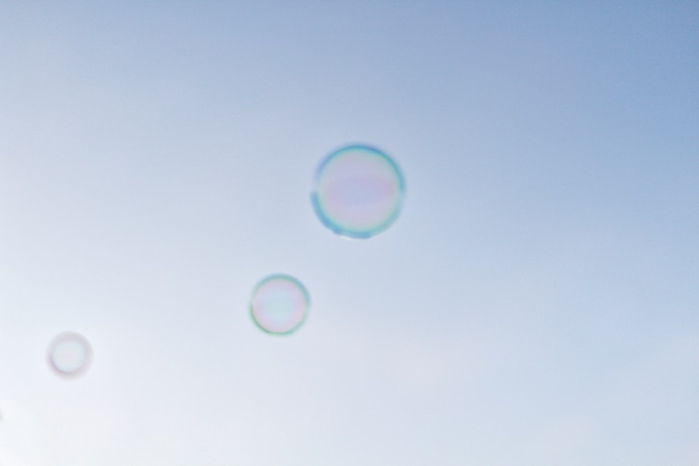 a group of soap bubbles floating in the air