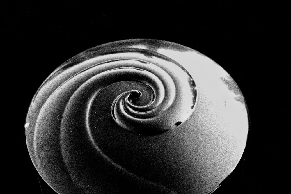 a black and white photo of a spiral shaped object