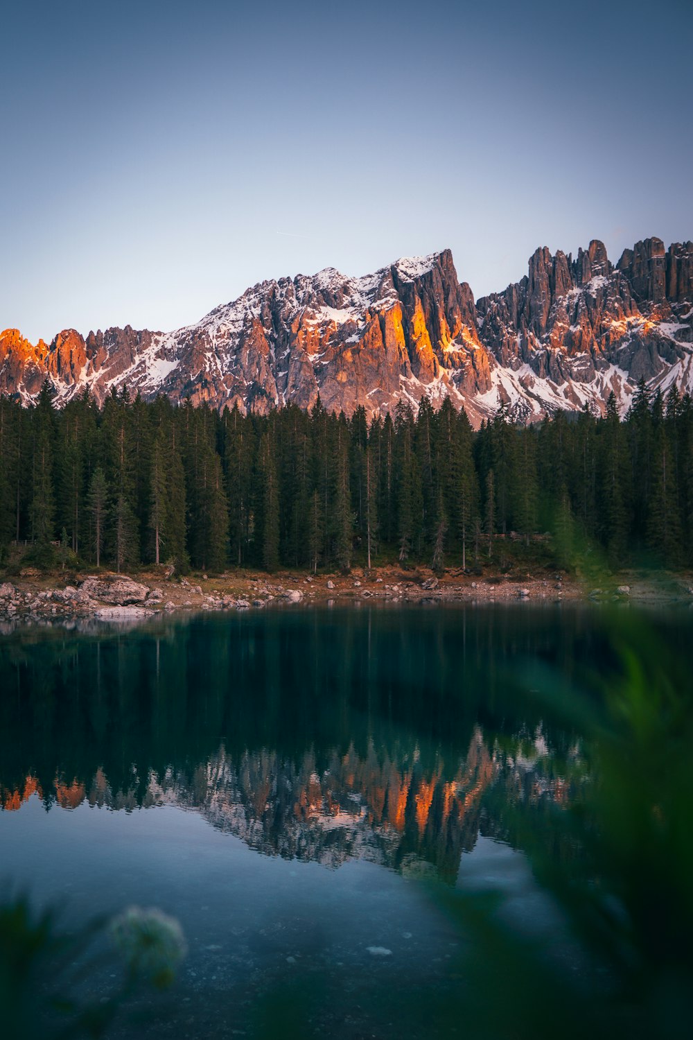 a mountain range with a lake in front of it