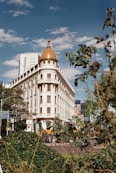 a large white building with a golden dome