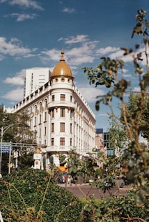 a large white building with a golden dome