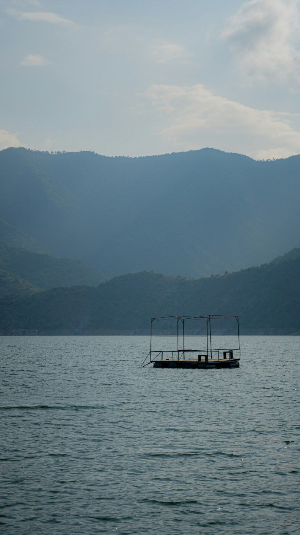 a boat floating on top of a large body of water