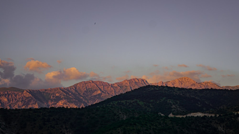 a view of a mountain range at sunset