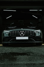 a mercedes benz car parked in a garage