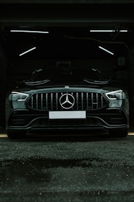 a mercedes benz car parked in a garage