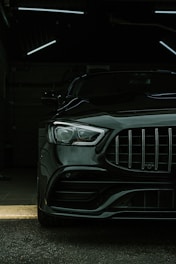 a black car parked in a parking garage