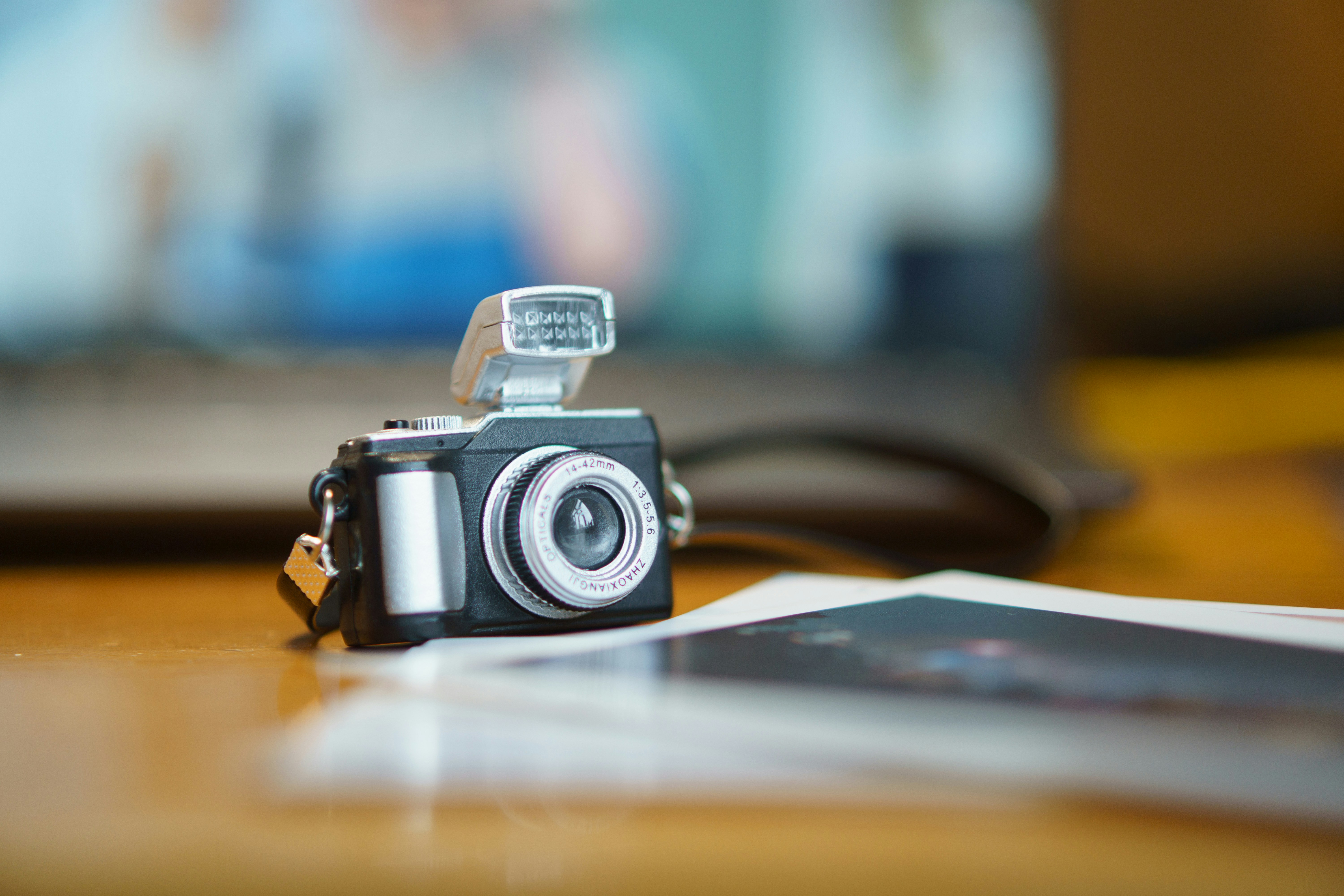 a camera sitting on top of a wooden table