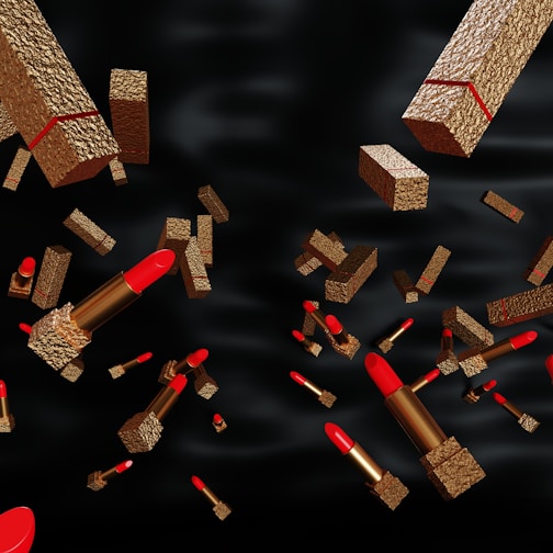 Close-up of vibrant Kryolan lipsticks arranged on a sleek black and red animated background.