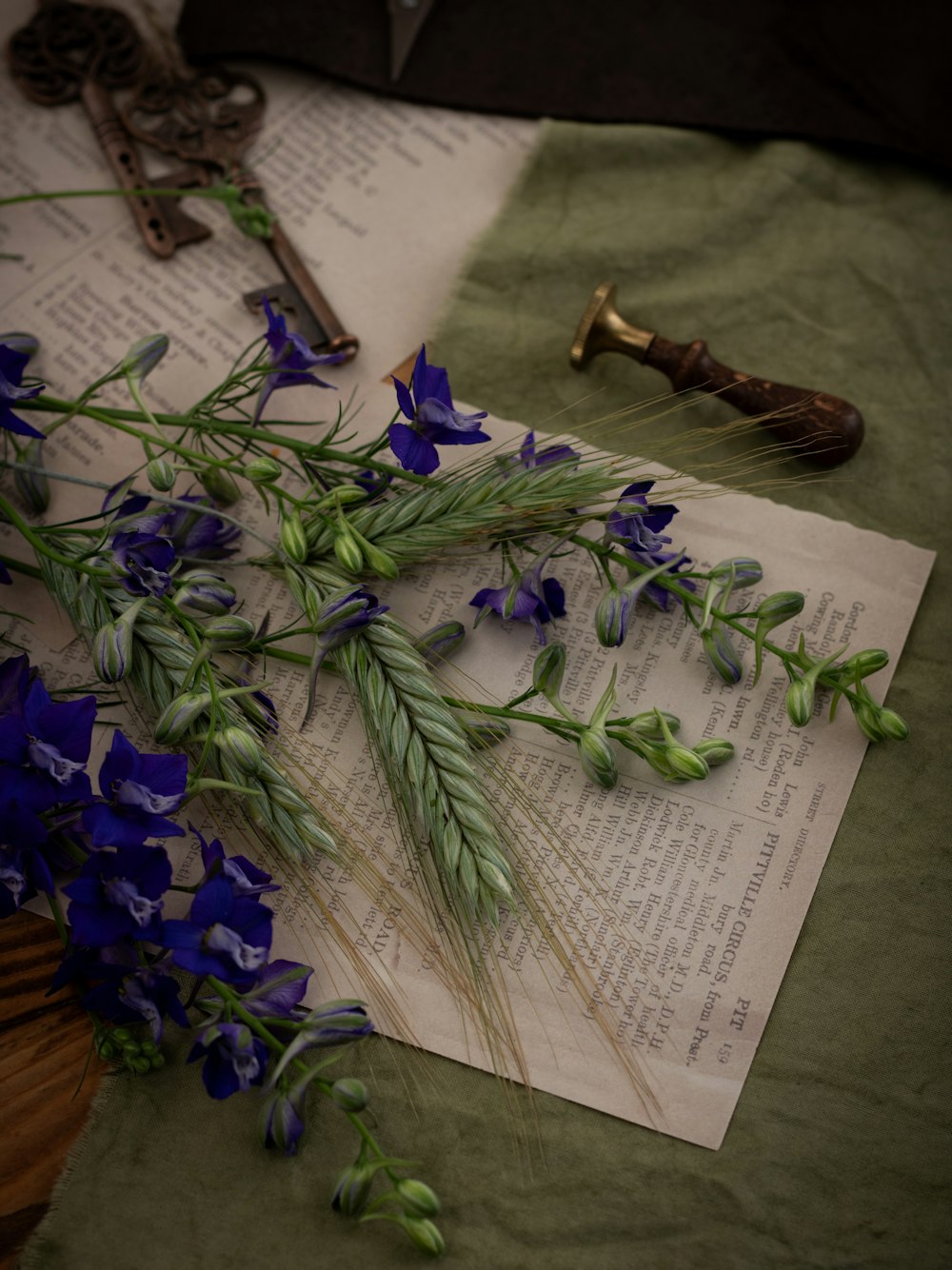 a bunch of flowers sitting on top of an open book