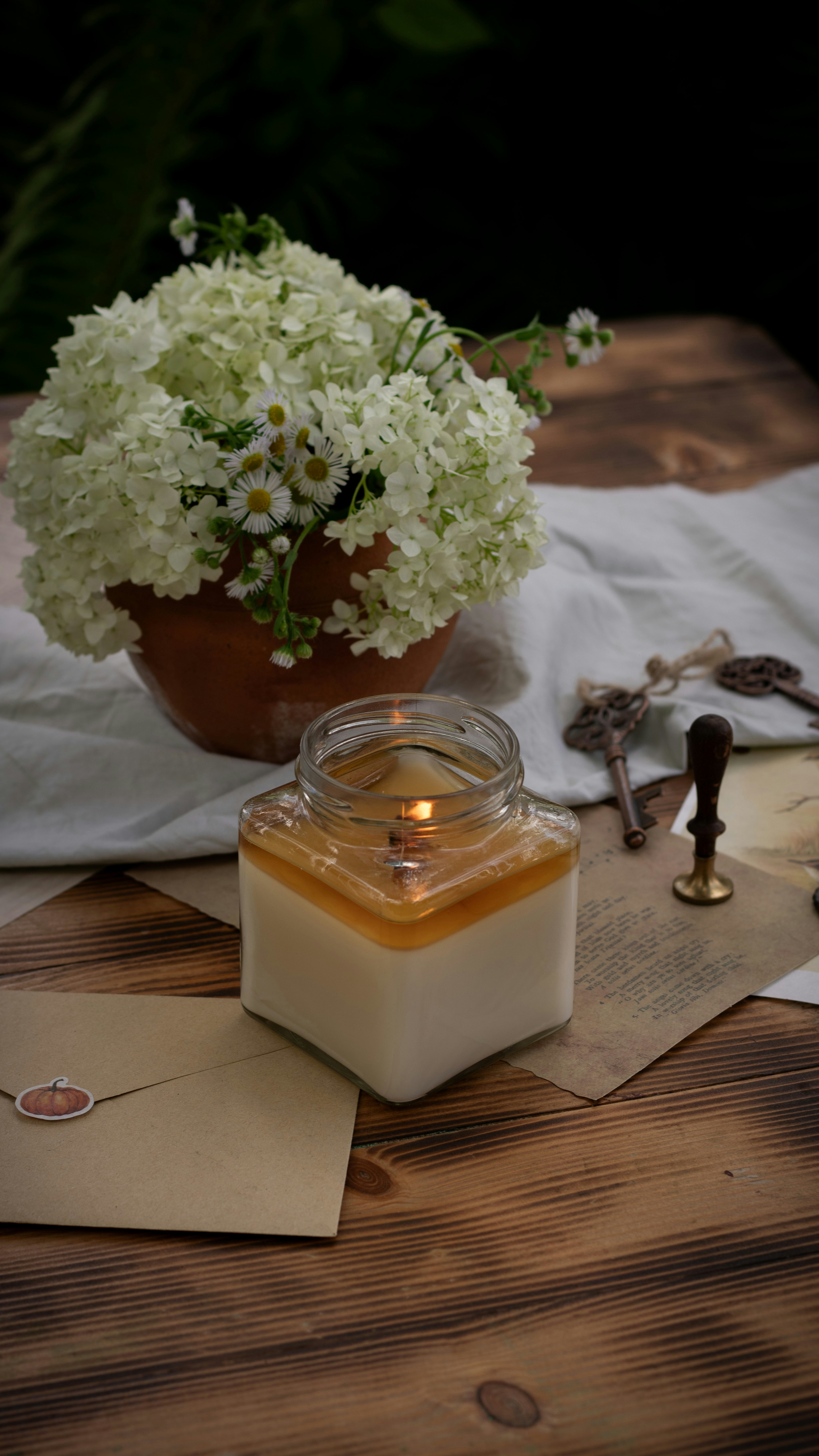A vase of white flowers sitting on top of a wooden table photo – Free ...