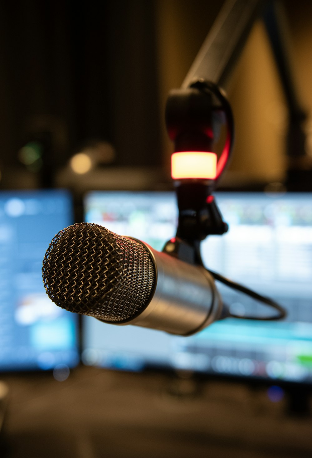 a microphone in front of a computer monitor