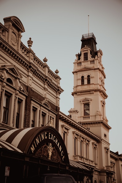 an old building with a clock tower in the background