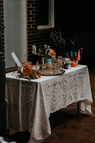 Refreshing chilled beverages arranged on a rustic wooden table ready for a party.