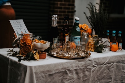 A fully set up bar featuring colorful cocktails and detailed glassware ready for guests.