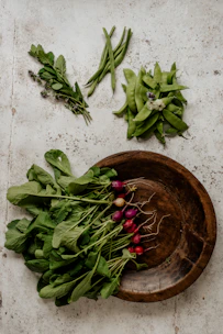 Close-up of fresh produce from a local farm arranged artfully on a crisp parchment background.