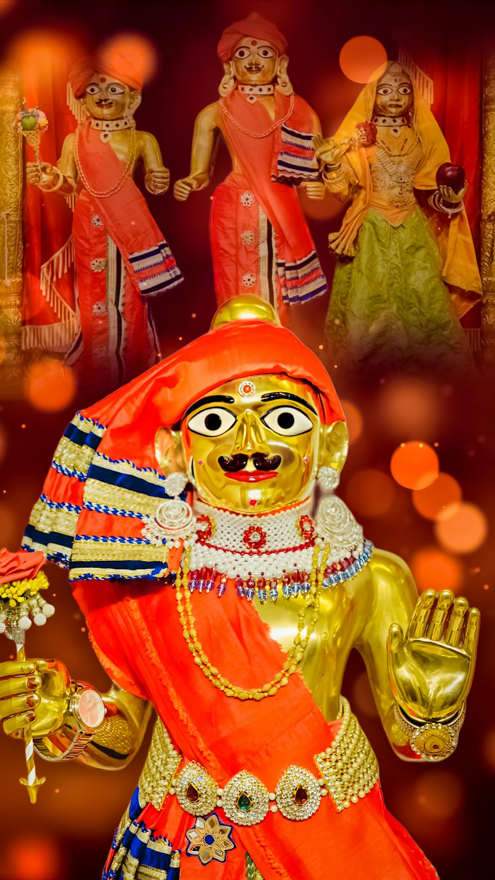 a golden statue of a man in a red outfit