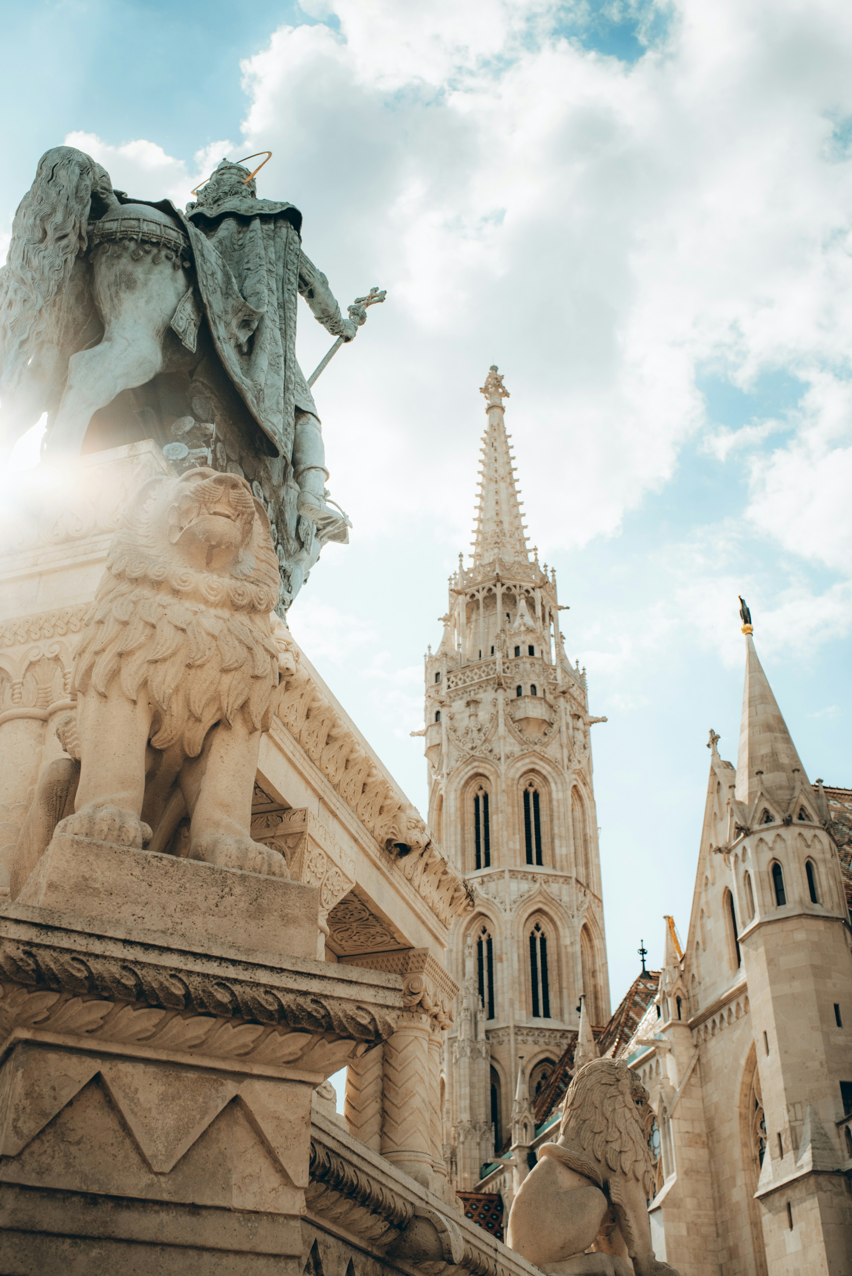 a statue of an angel on top of a building