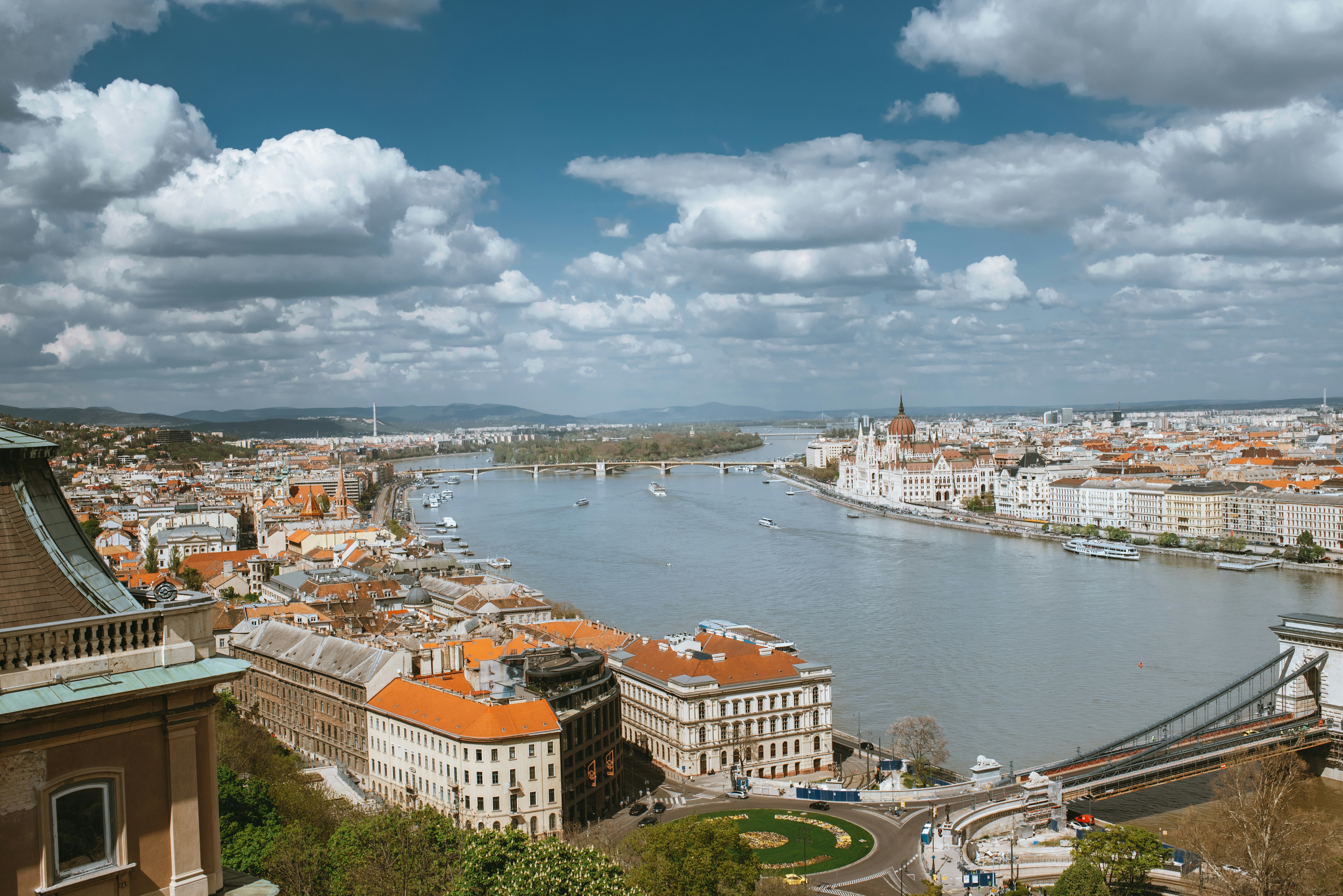 a river running through a city next to a bridge