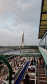 Guests enjoying a meal on a rooftop with temple views.