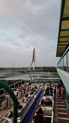 Guests enjoying a meal on a rooftop with temple views.