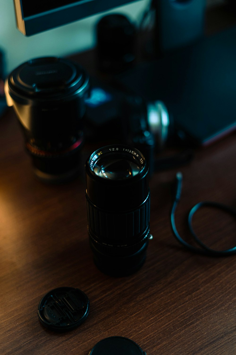 a camera and a lens on a table