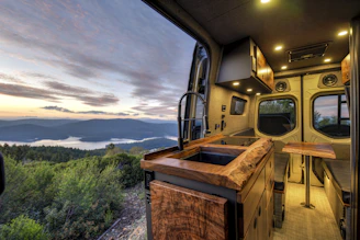 Interior view of the XGO X-Van camper showing cozy, minimalist design with natural light.