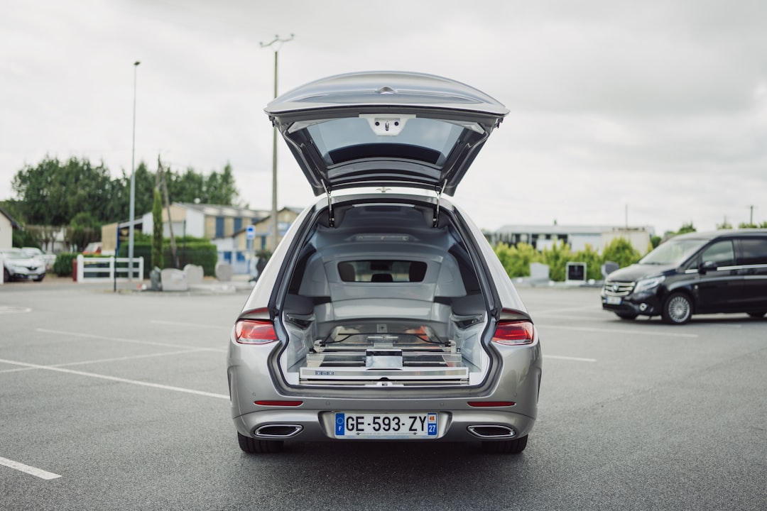 a car with its trunk open in a parking lot,