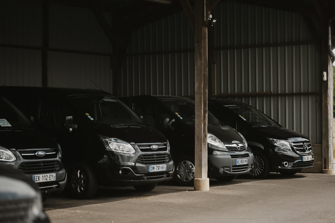 a row of parked cars in a garage,