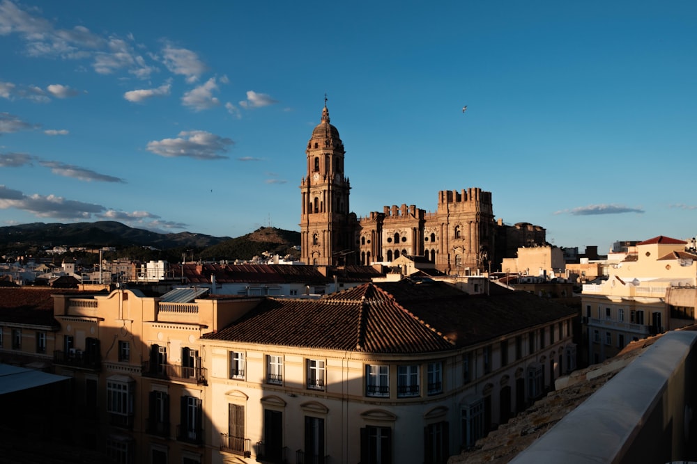 a tall building with a clock tower towering over a city