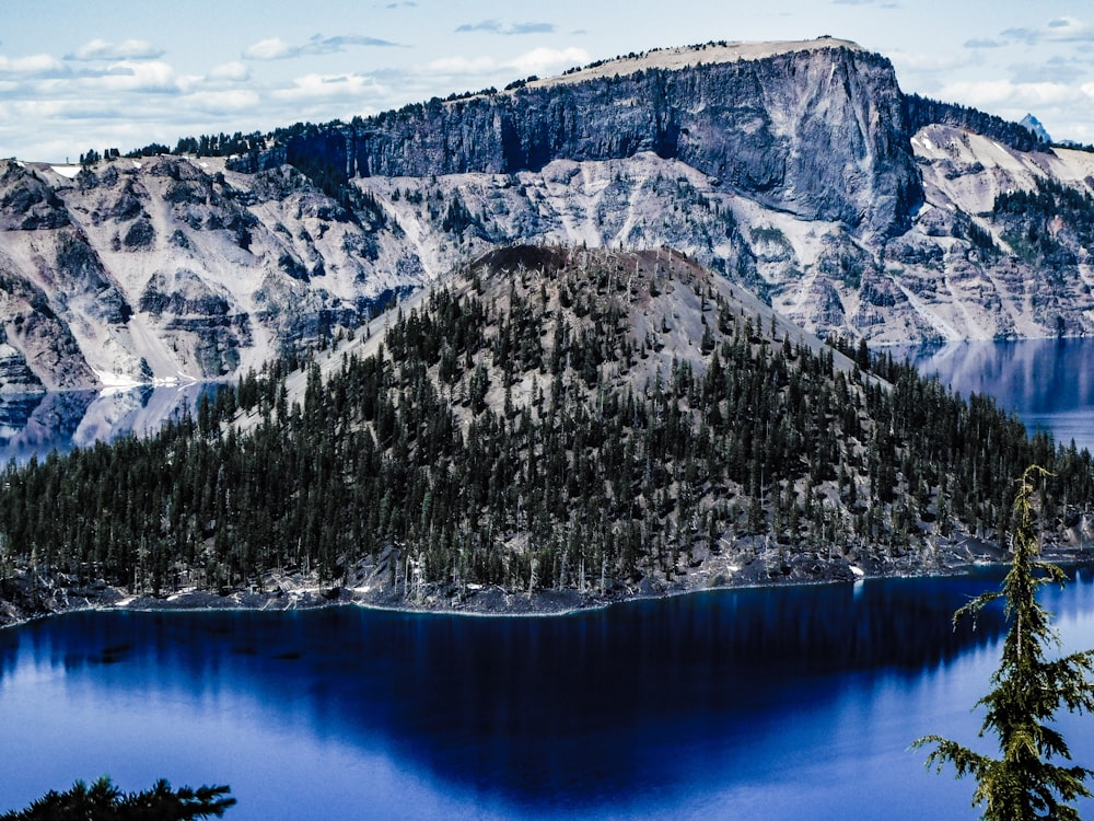 a large lake surrounded by mountains and trees