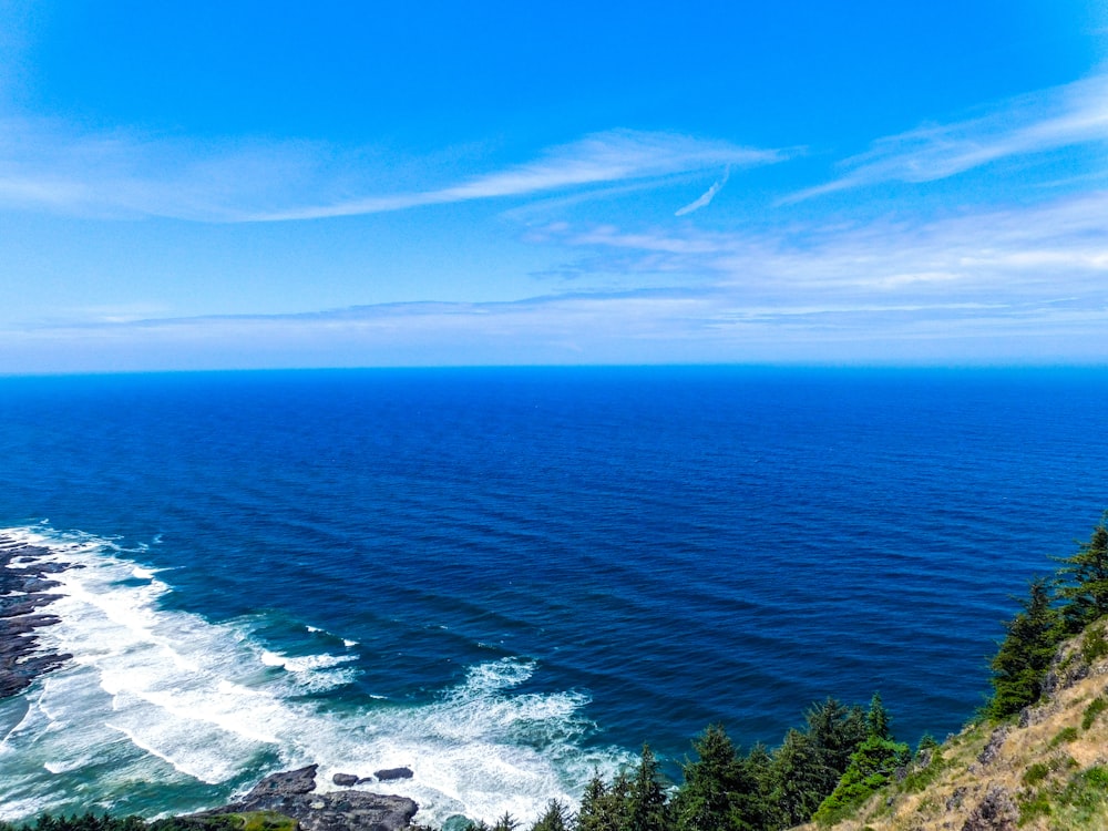 a scenic view of the ocean from a cliff