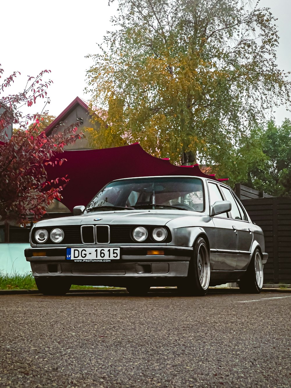 a silver car parked on the side of a road