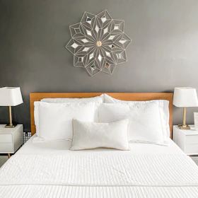 Before and after images of a renovated bedroom highlighting transformation and style.